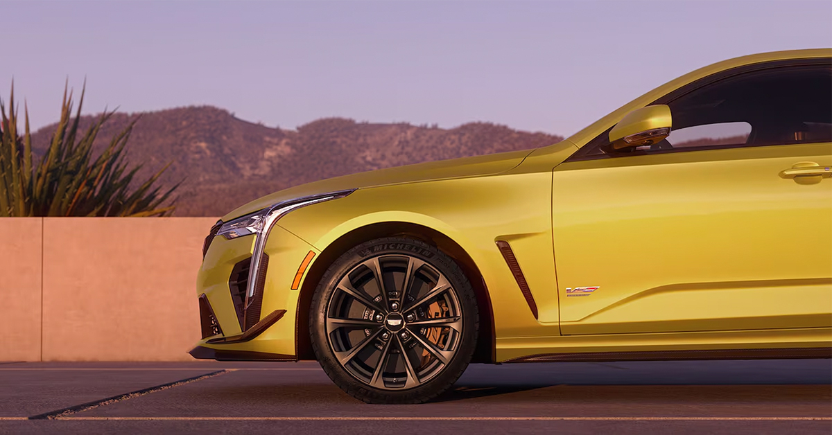 2025 Cadillac CT4-V Sedan side view with mirrors in view